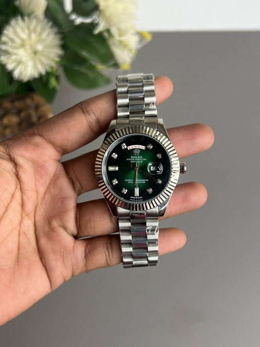 Rolex Day-Date 40 with an olive green dial and a white gold finish, commonly associated with the 60th anniversary edition of the timepiece.