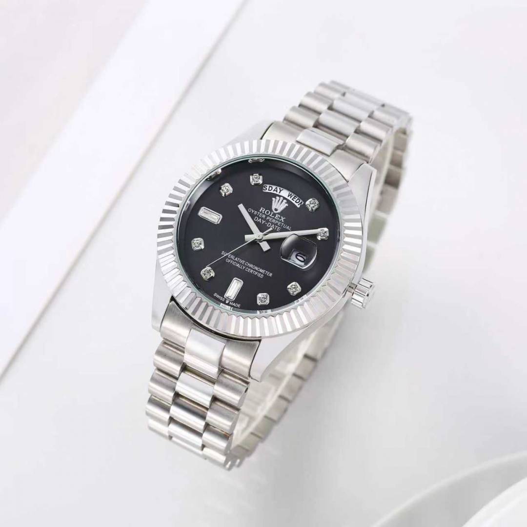 Rolex Day-Date watch with a black dial and a fluted bezel on a President-style bracelet.